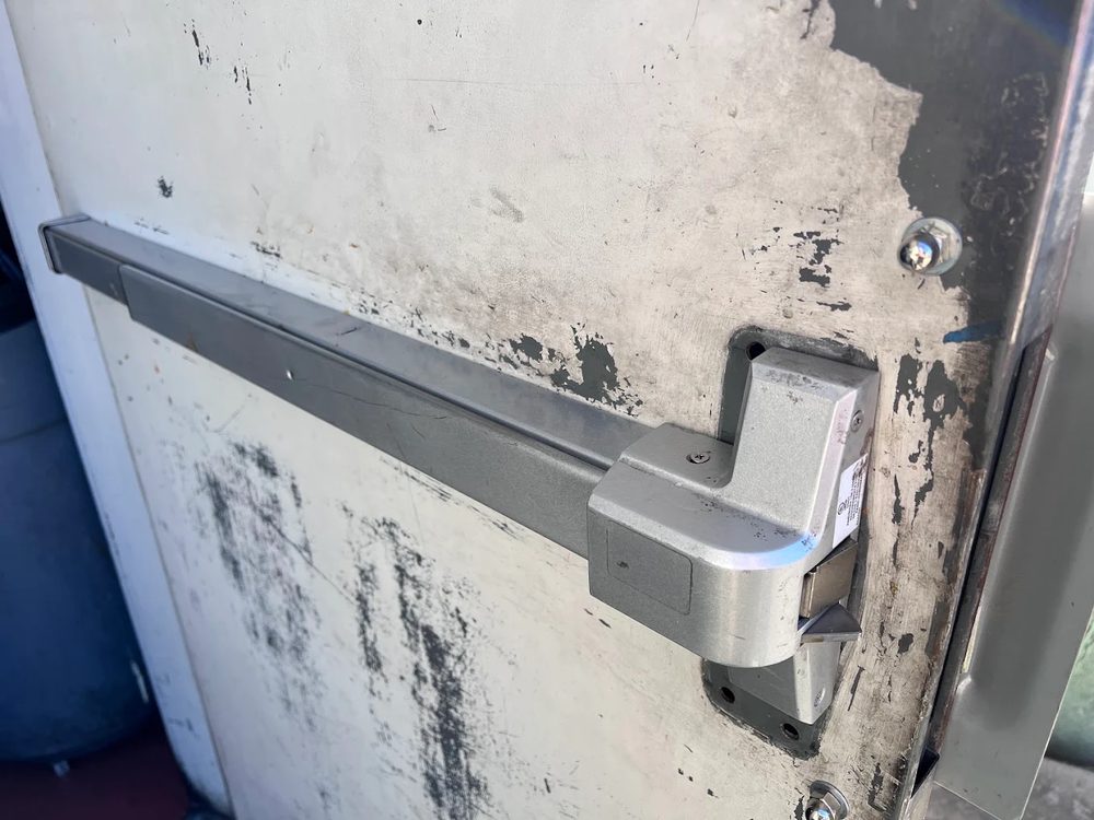 Commercial panic exit bar hardware installed by S.E.L Locksmith